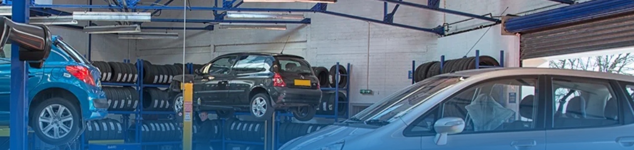An image showing cars in a Kwik Fit garage