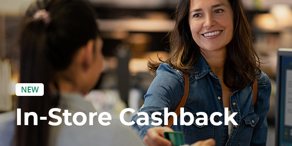 Image of a person inside a store paying with her credit card at a till. The text says New - In-Store Cashback